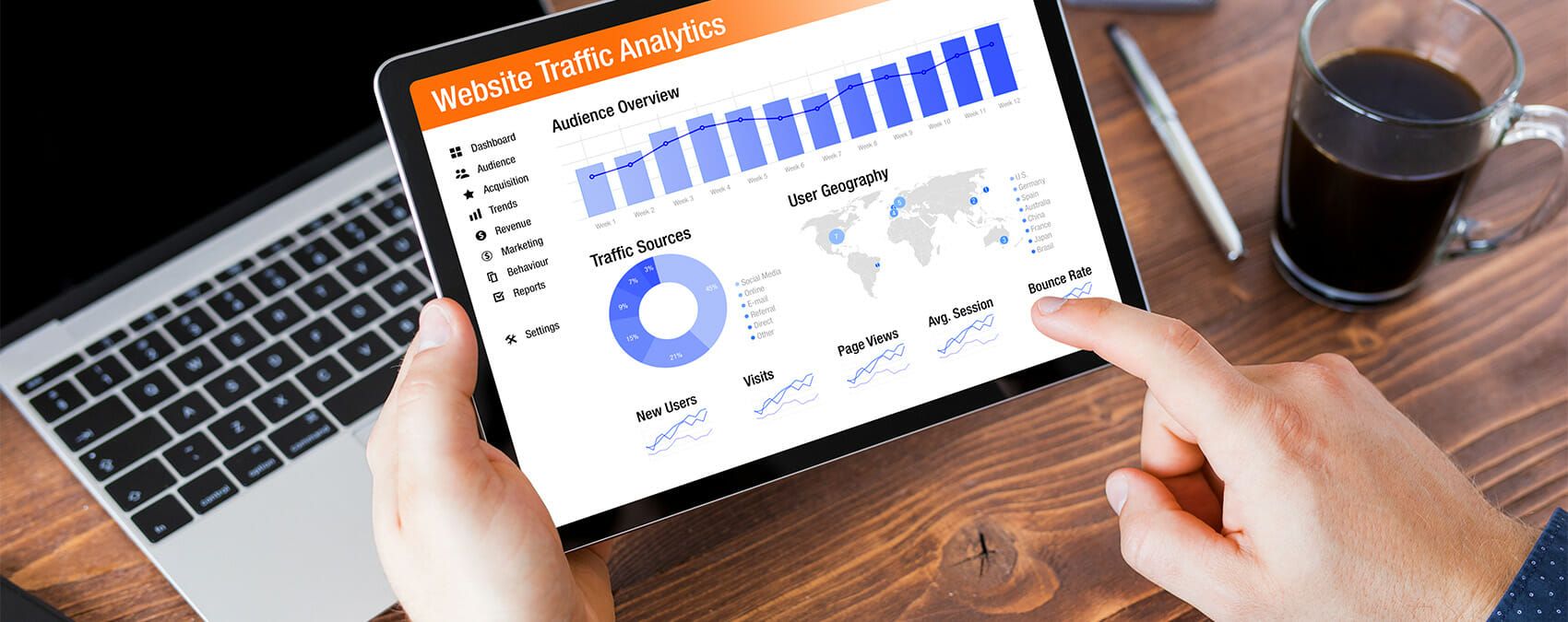 A person holds a tablet showing an analytics dashboard titled 'Website Traffic Analytics' comprised of various charts
