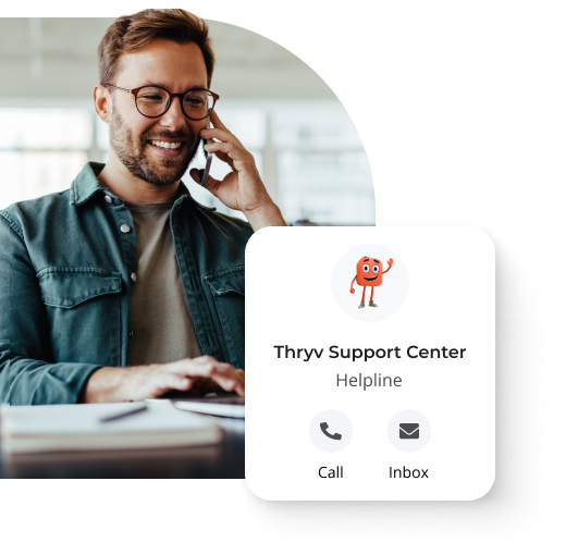 Man smiling while on the phone with a pop-up that says 'Thryv Support Center Helpline' and an option for 'Call' and 'Inbox'