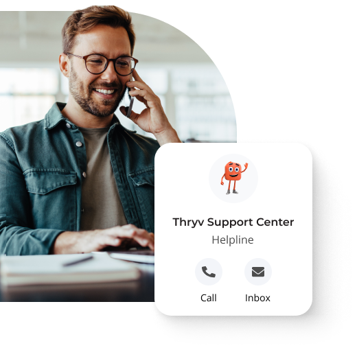 Man smiling while on the phone with a pop-up that says 'Thryv Support Center Helpline' and an option for 'Call' and 'Inbox'