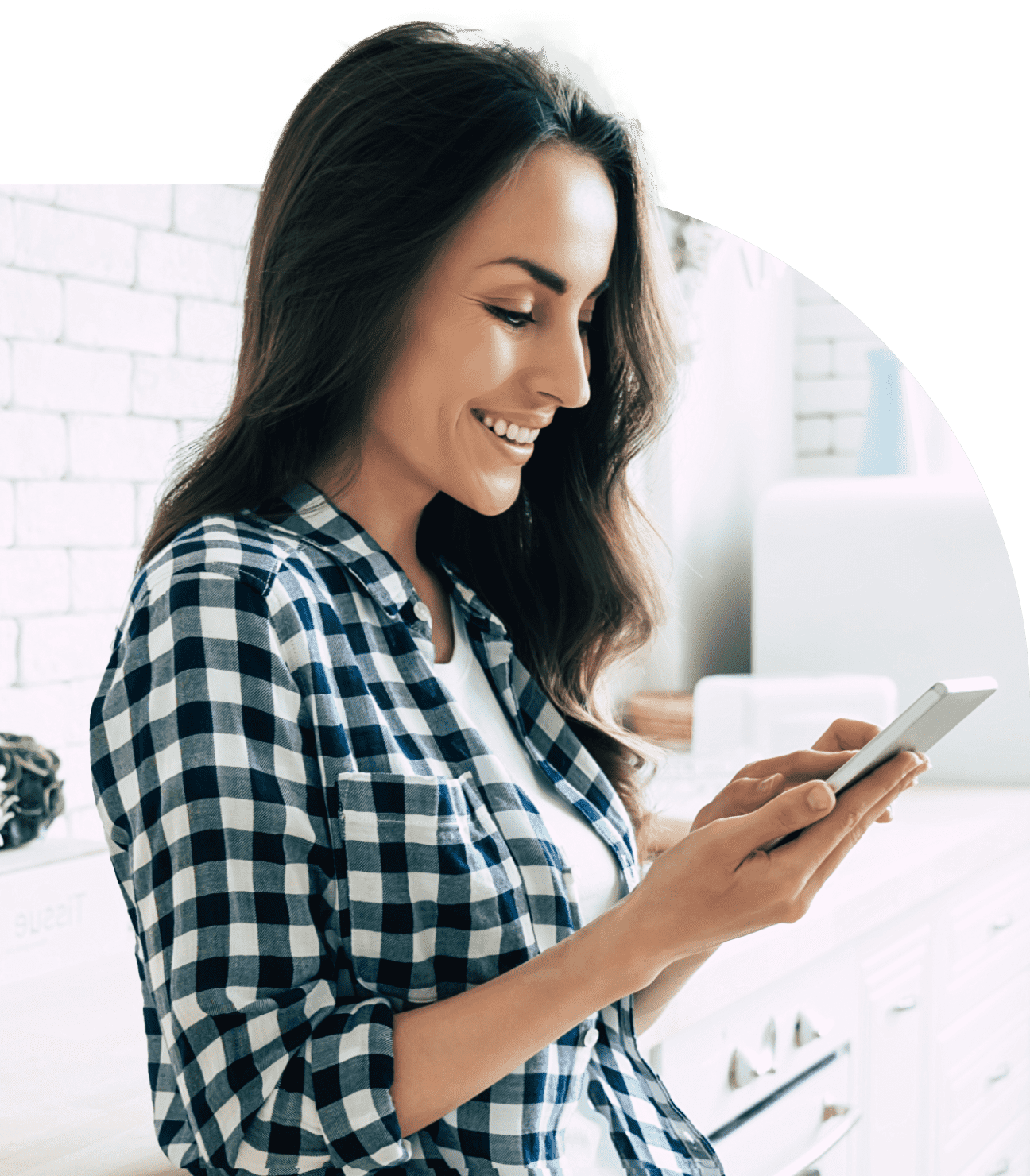 A woman smiling while on her phone